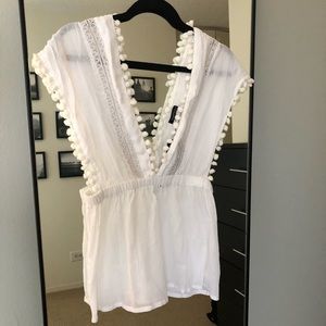 White tank with pom poms and deep V neck